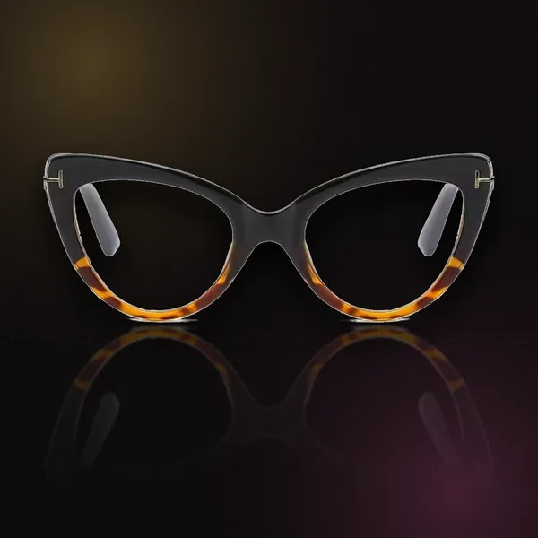 The SoHo — black-to-tortoise cat-eye frame with gold hinge accents and clear lenses