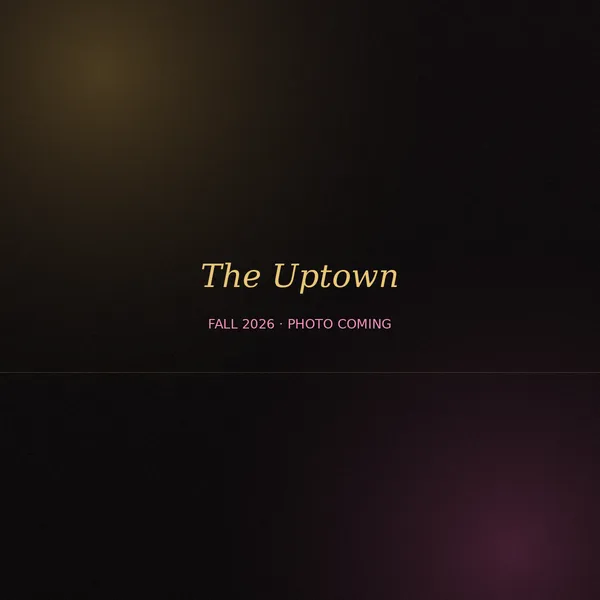 The Uptown — black double-bridge aviator frame with gold rivets and clear lenses