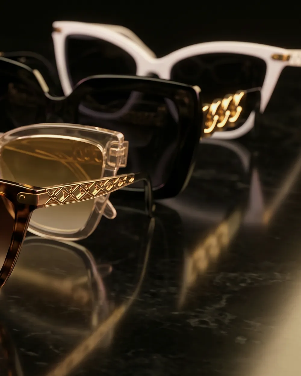 Bold black square and white sunglasses with gold chain temples
