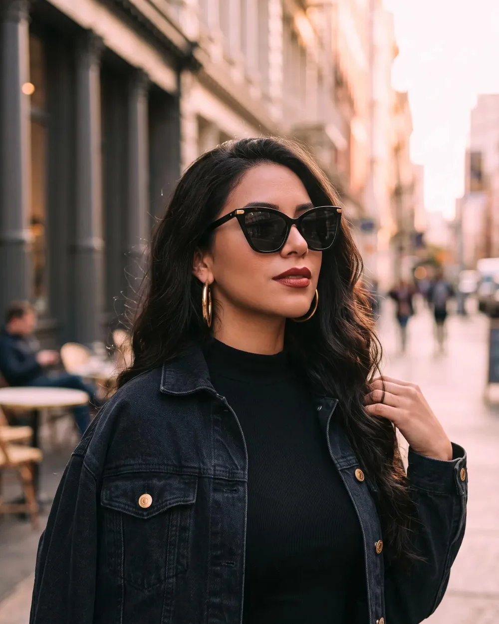 Woman on a SoHo street wearing the Noir Cat-Eye sunglasses